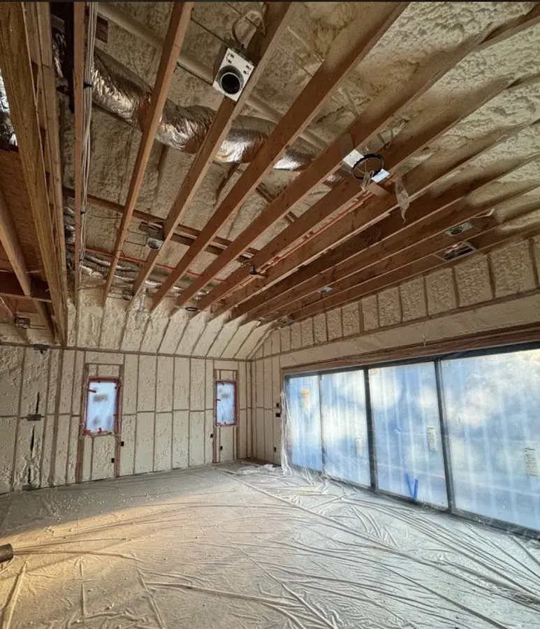 Interior walls and ceiling insulated with spray foam during new construction in Dripping Springs